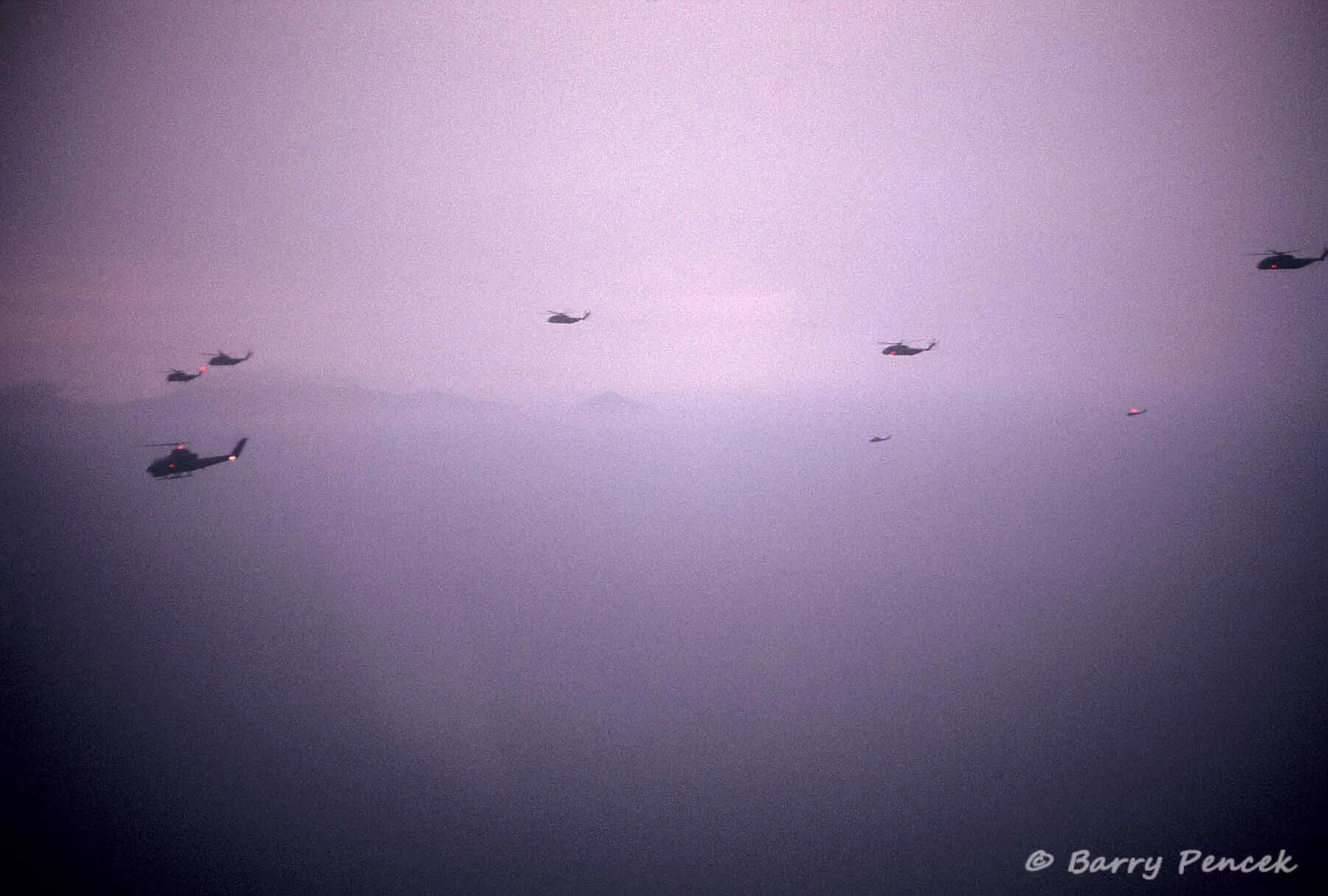 Formation of Helicopters in Flight at Dusk, Vietnam Highlands