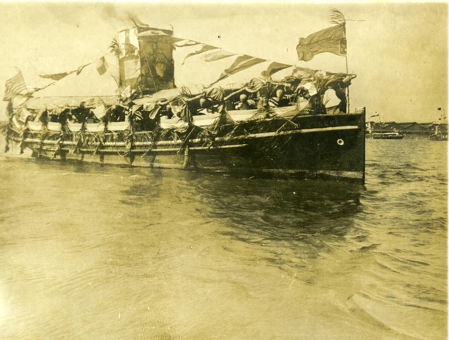 Decorated Harbor Launch "...CONCHA" with American Flag, Philippines, Early 1900s (Carl Stone Album)