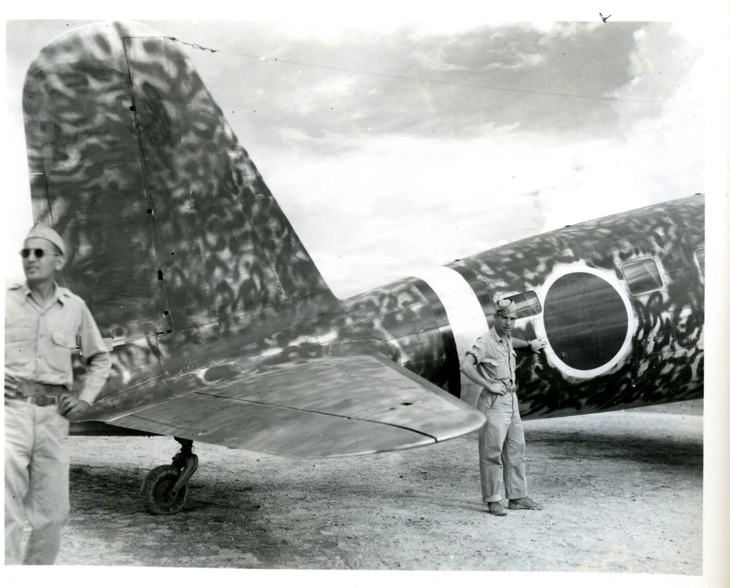 American Airmen with Camouflaged (Possibly Captured Japanese) Aircraft Tail Section, CBI Theater, World War II