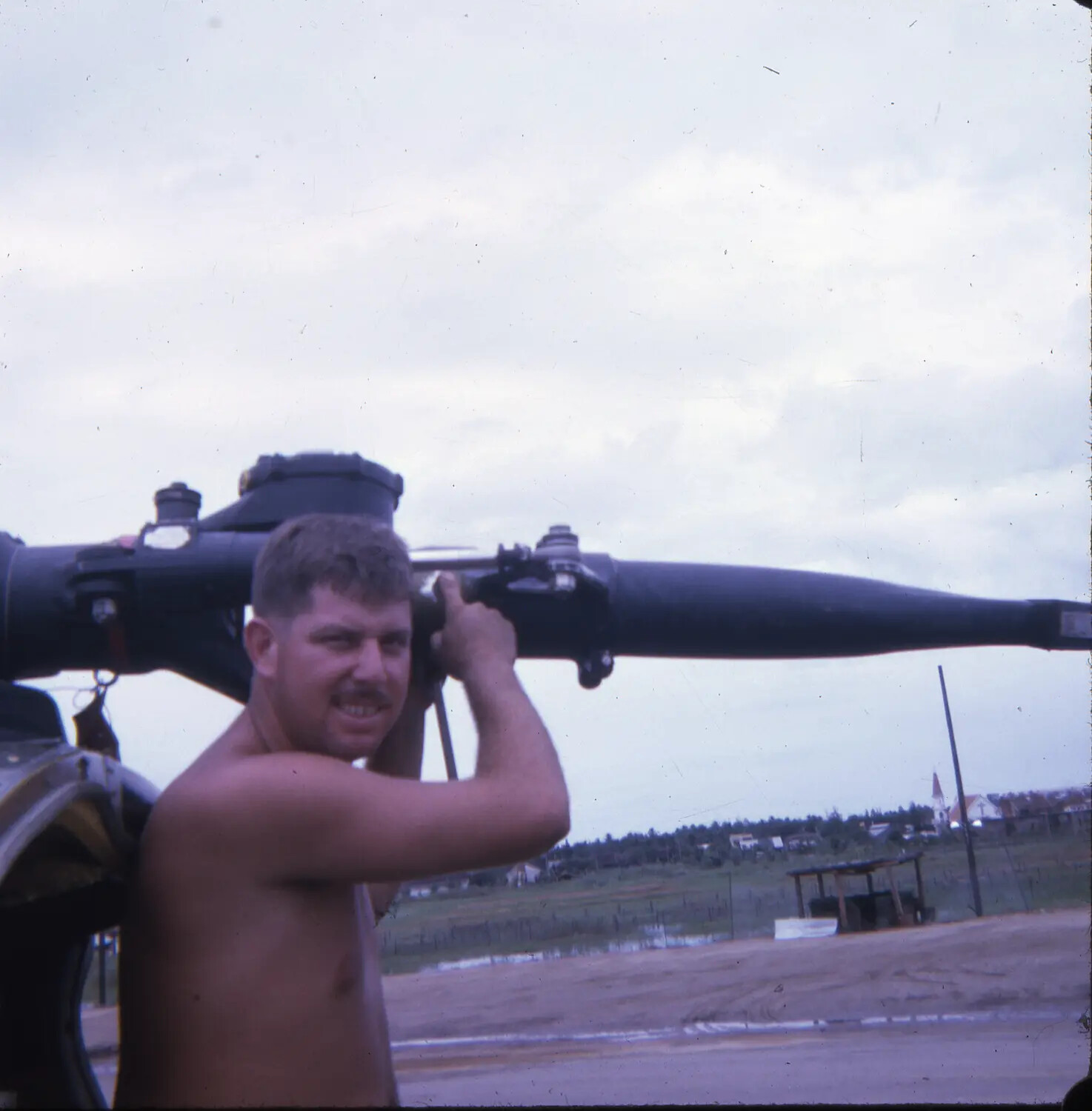 Serviceman Sighting Down Armored Vehicle Main Gun Barrel, Vietnam, Vietnam War Era