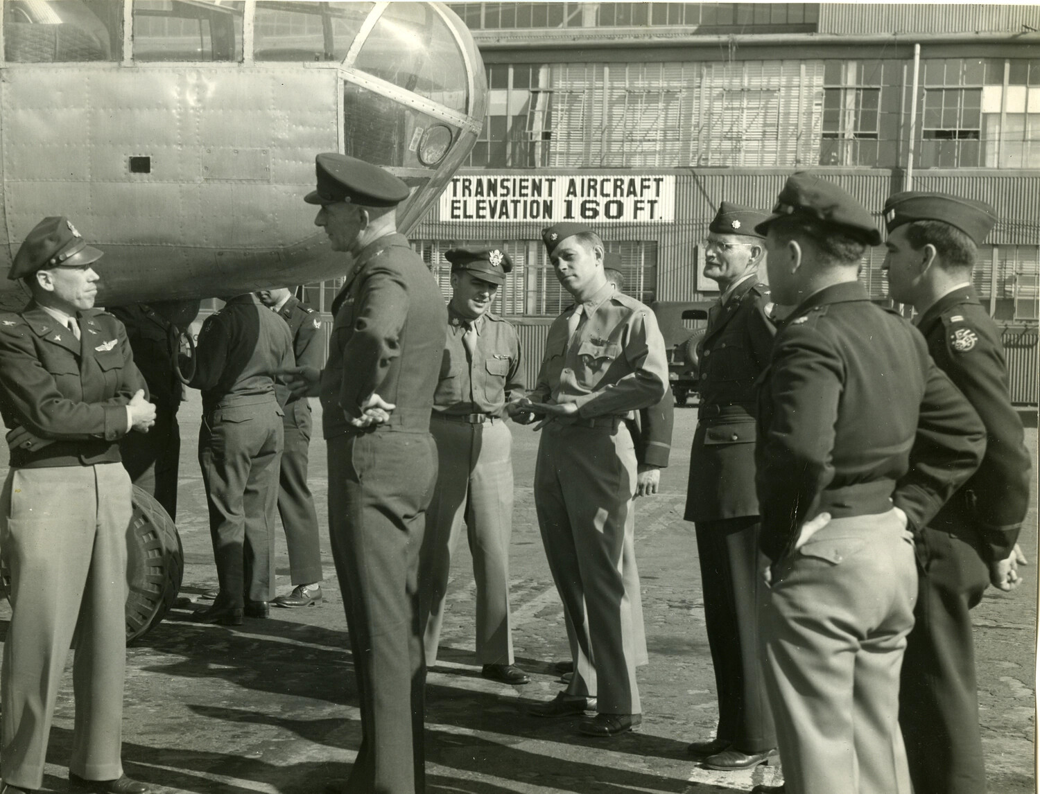 USAAF Officers Beside a B-29 Superfortress Nose Section at a Transient Aircraft Facility, World War II
