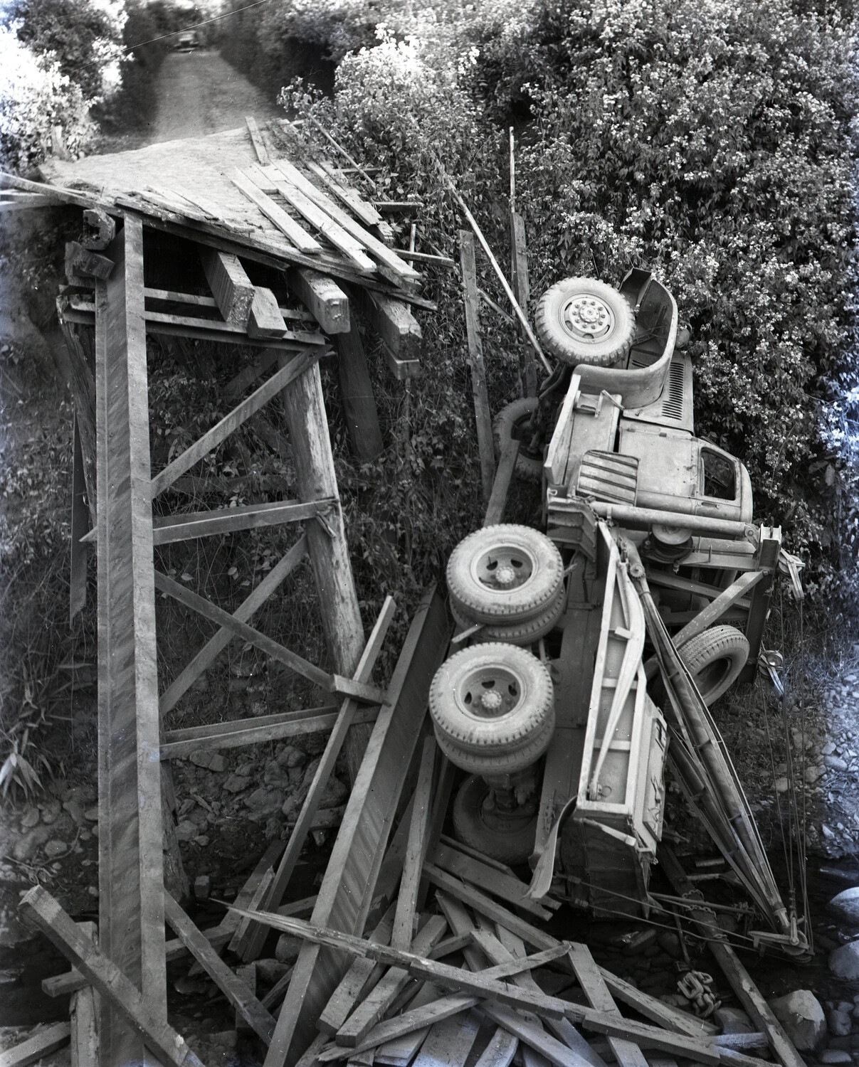 Wrecked U.S. Army Truck After Collapse of Wooden Trestle Bridge, China-Burma-India Theater