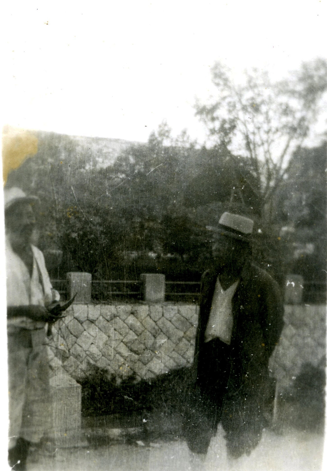 Two Men at Ornamental Stone Bridge, Likely Asia Travel/Leave Photograph