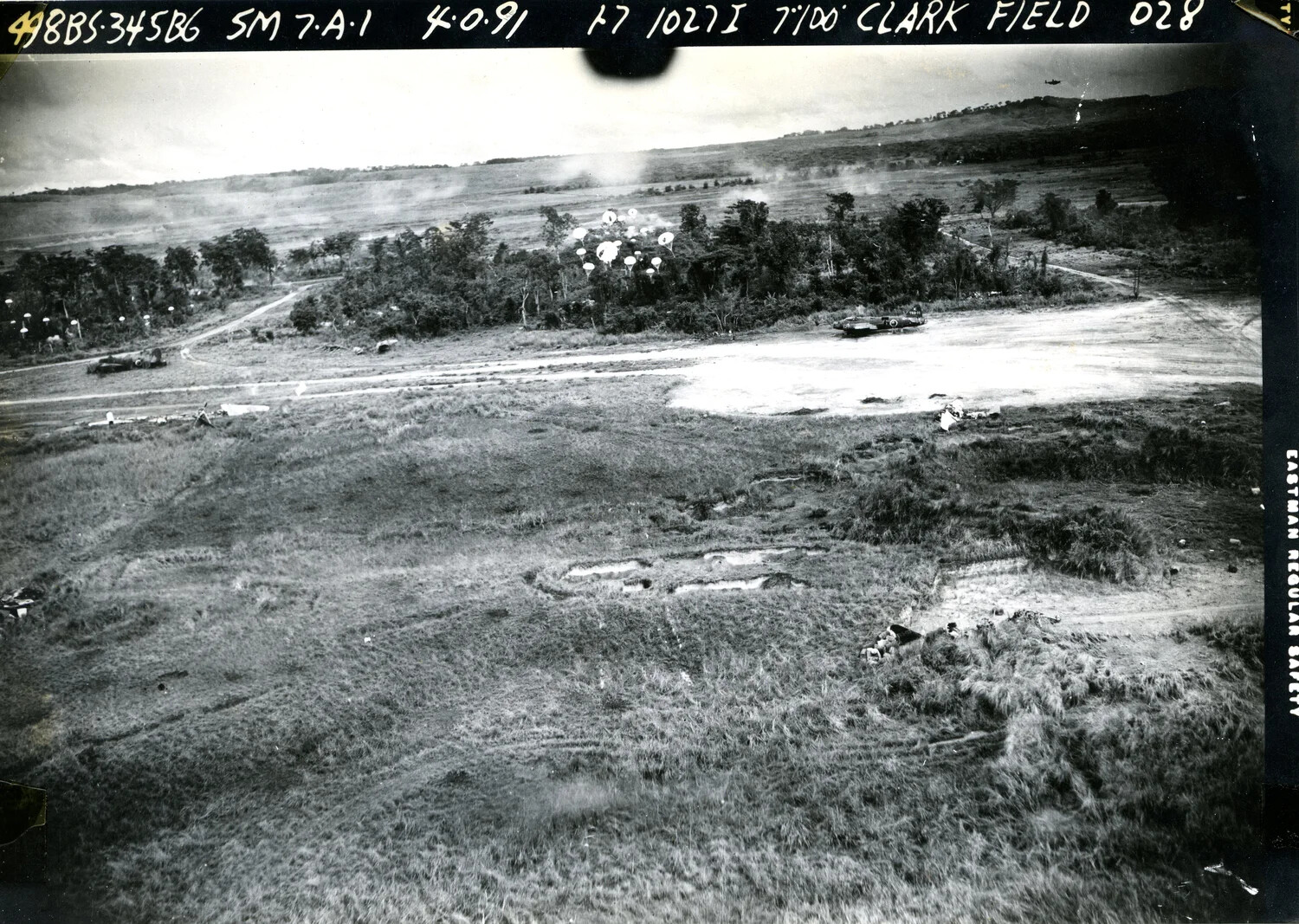 Strike Photograph: 345th Bombardment Group (498th Bomb Squadron) Parafrag Attack on Clark Field, Luzon, Philippines, WWII
