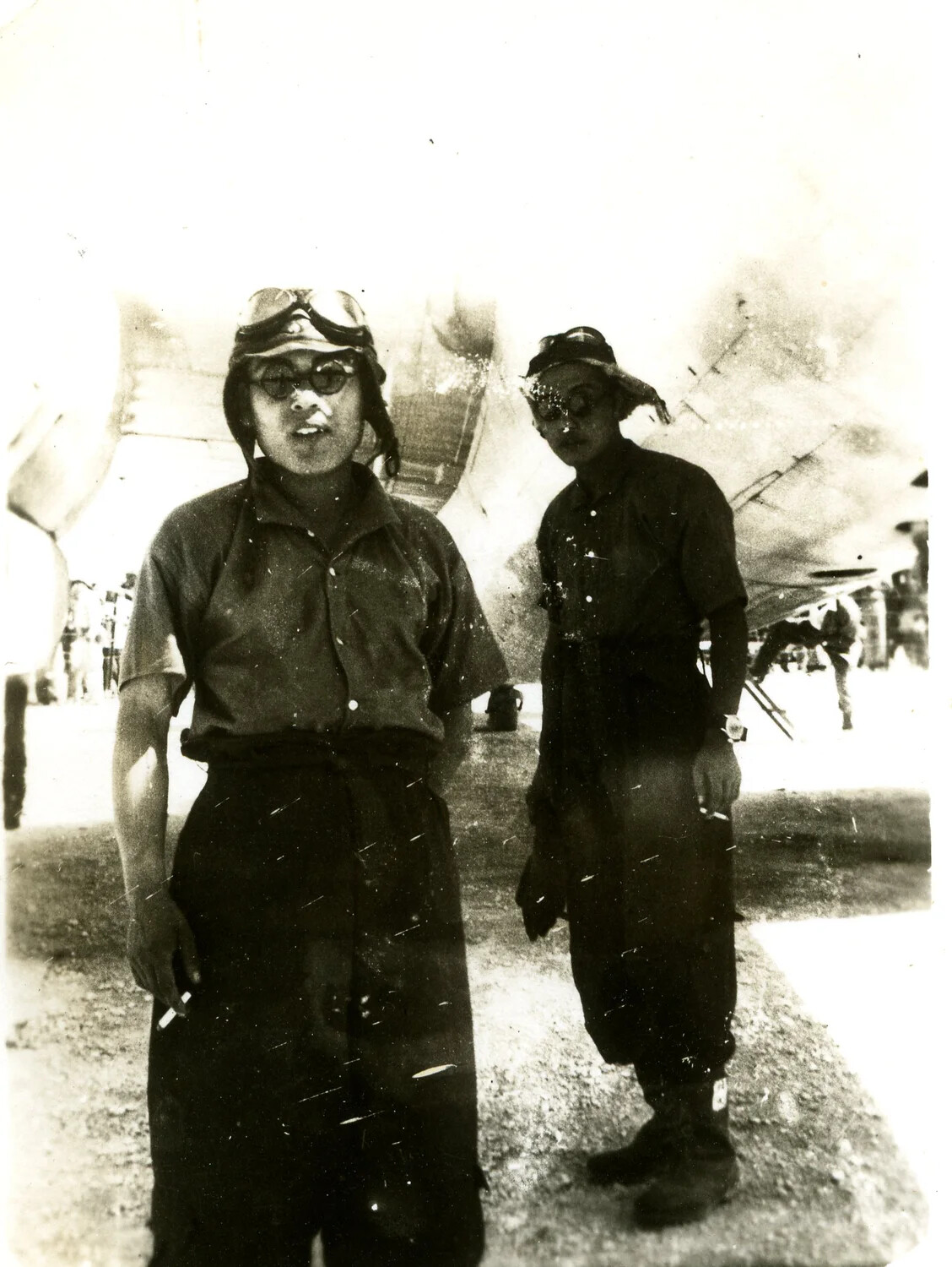 Portrait of Two Japanese Aircrew Members Beside Their Bomber, Ie Shima, 19 August 1945