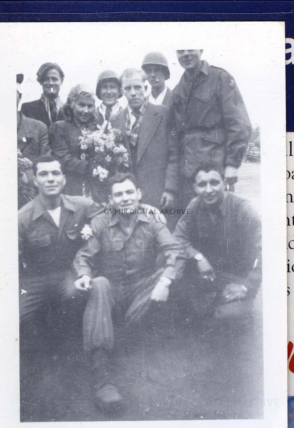 101st Airborne Division Paratroopers Pose with European Civilians and Floral Bouquet, WWII Liberation-Era Group Portrait