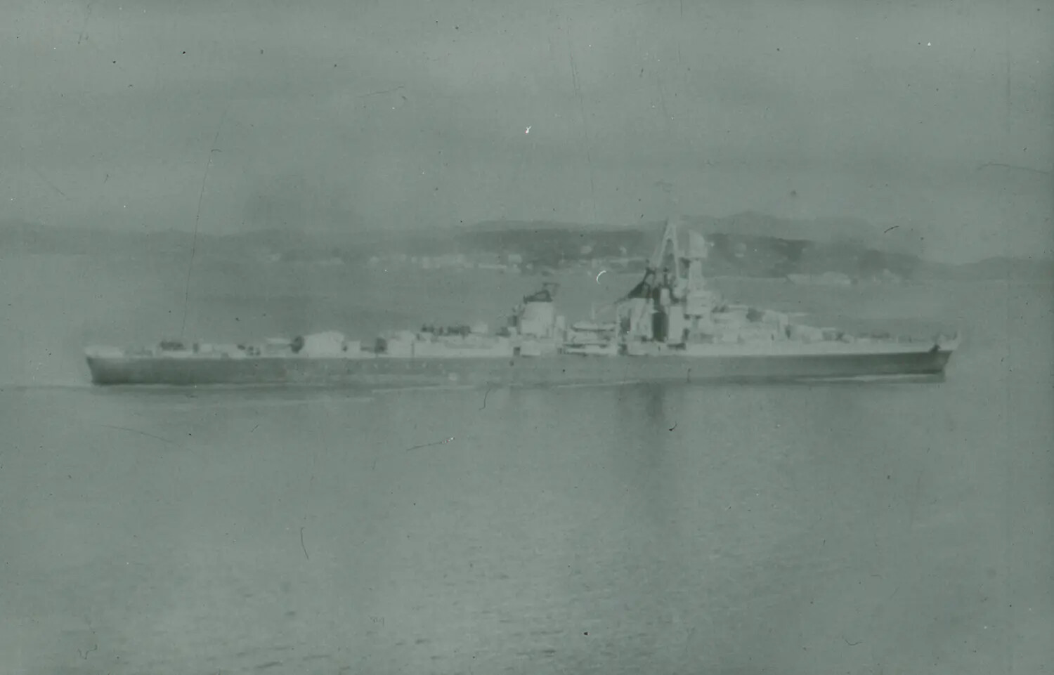 World War II-Era Cruiser Underway Near Coastline, 35mm Negative