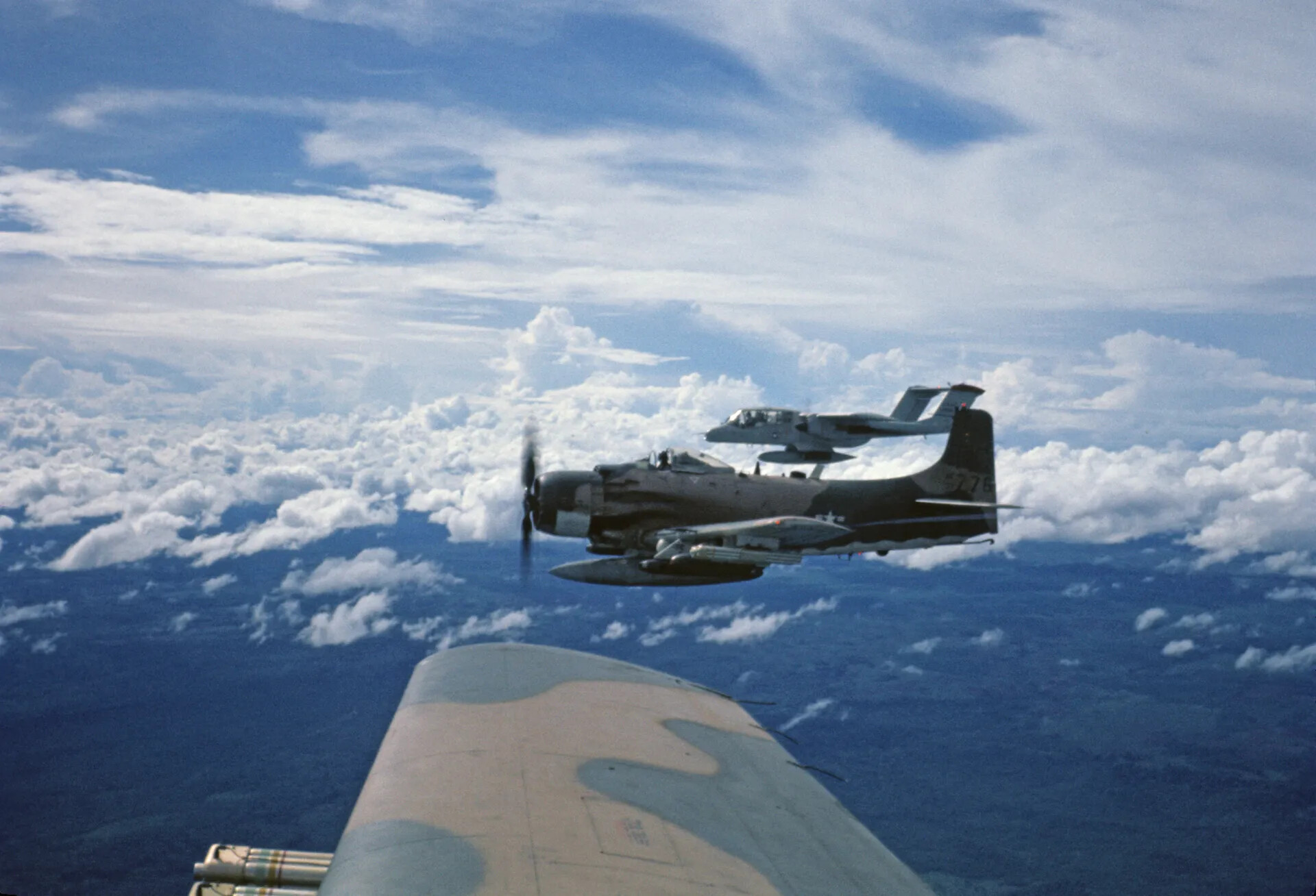 A-1 Skyraider and OV-10 Bronco in Formation Over Vietnam, Air-to-Air View
