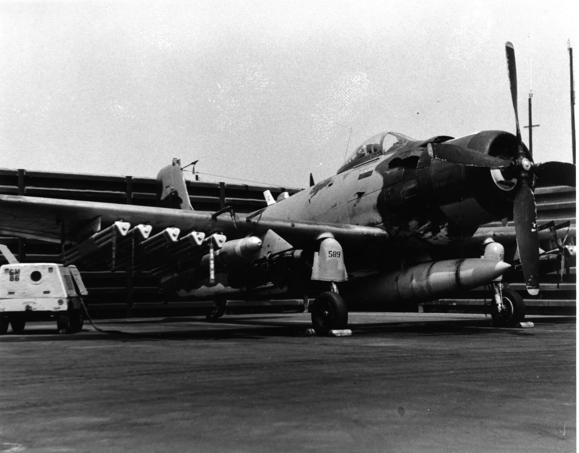 Armed A-1 Skyraider on Flight Line, Vietnam War, Larry Cavender/JW Collection