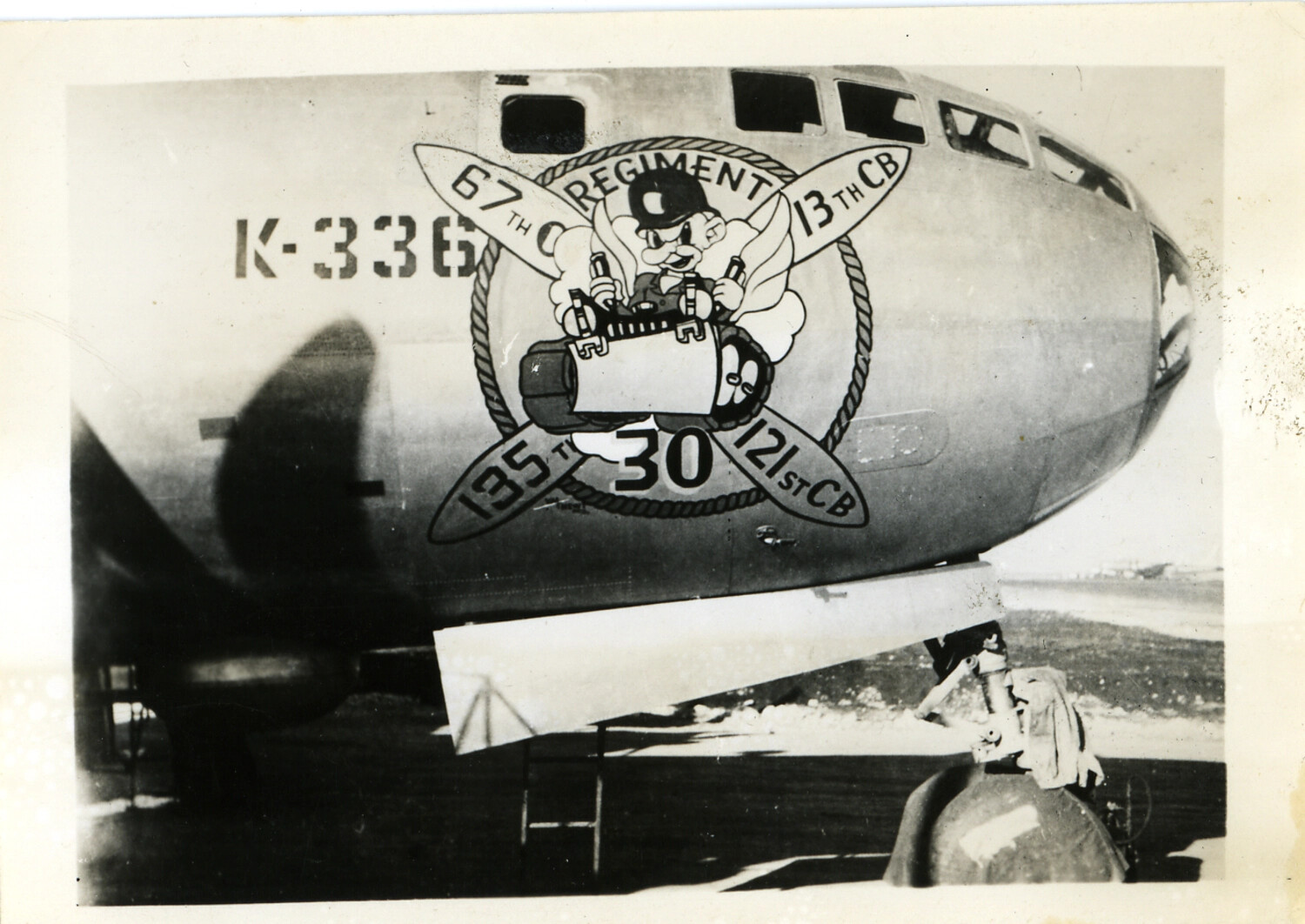 Nose Art and Unit Insignia "67th Regiment / 13th CB / 121st CB" on B-29 Superfortress K-336, World War II