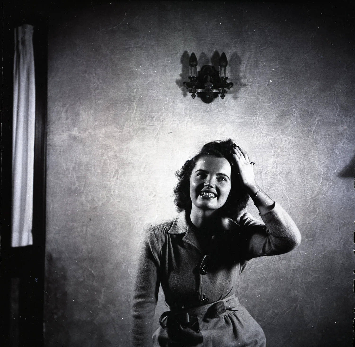 Portrait of a Smiling Young Woman Indoors