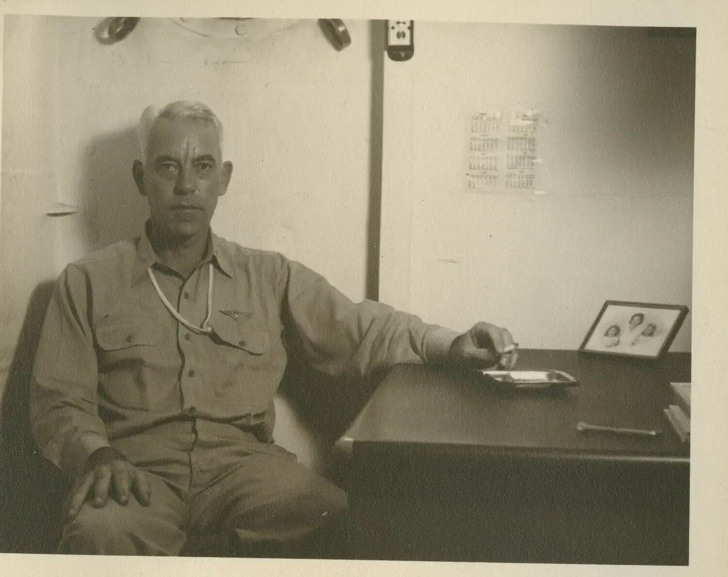 Naval Aviator Officer Seated at Desk, USS Petrof Bay (CVE-80) Collection, WWII
