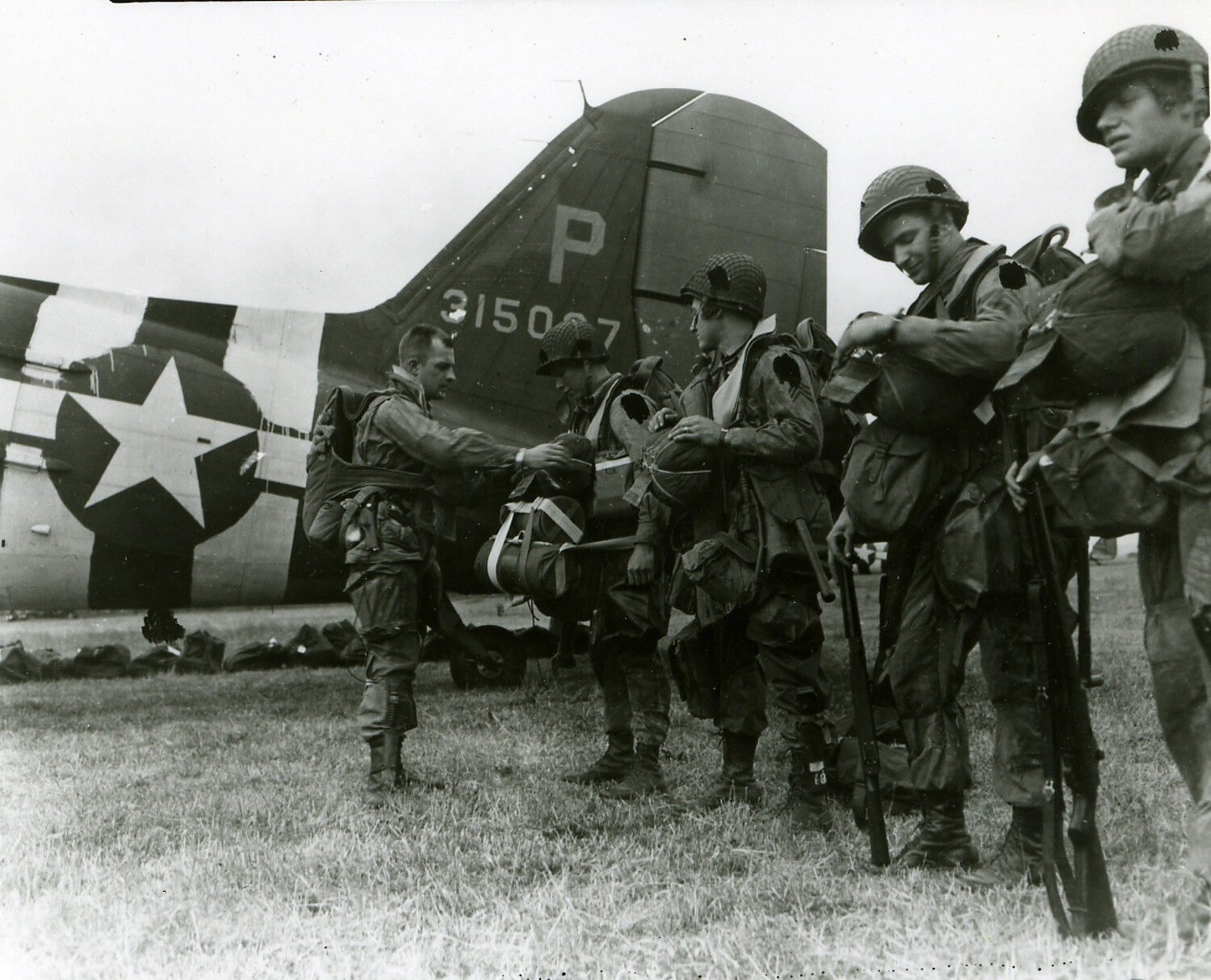 101st Airborne Paratroopers Donning Parachutes Beside a C-47 Transport Before a Jump, WWII