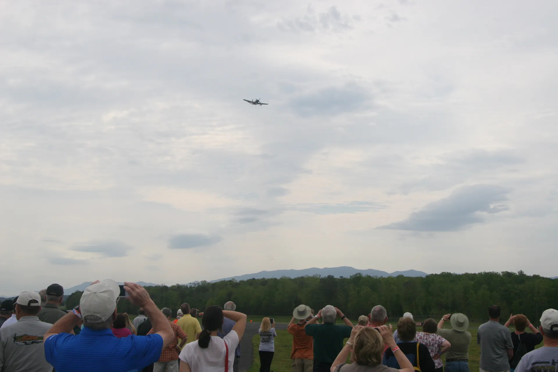 Spectators Observe A-1 Skyraider Flyover at Operation Tailwind Commemorative Event, 2016 (Sequence Frame)