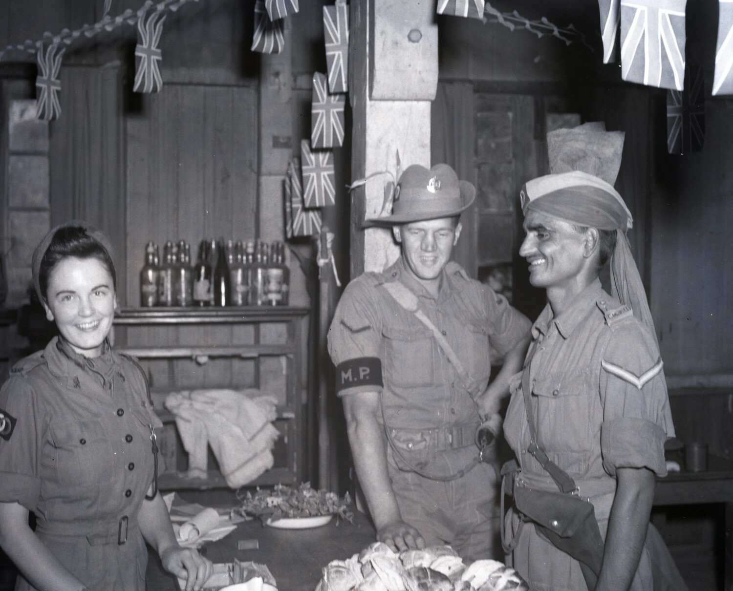 British, Indian Army, and Servicewomen's Corps Personnel at a Social Gathering, Katha, Burma, WWII (Major Turner Collection, KOTEC China Burma)