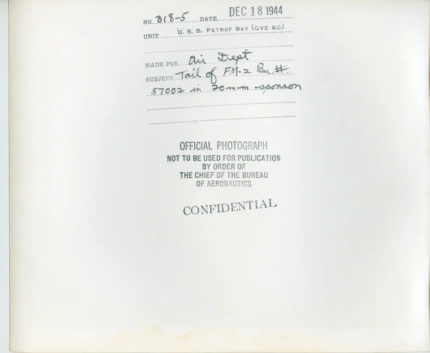 U.S. Navy Bureau of Aeronautics Photograph Caption Sheet: 'Tail of FM-2 Bu# 57002 in 20mm Sponson', USS Petrof Bay (CVE-80), 18 December 1944