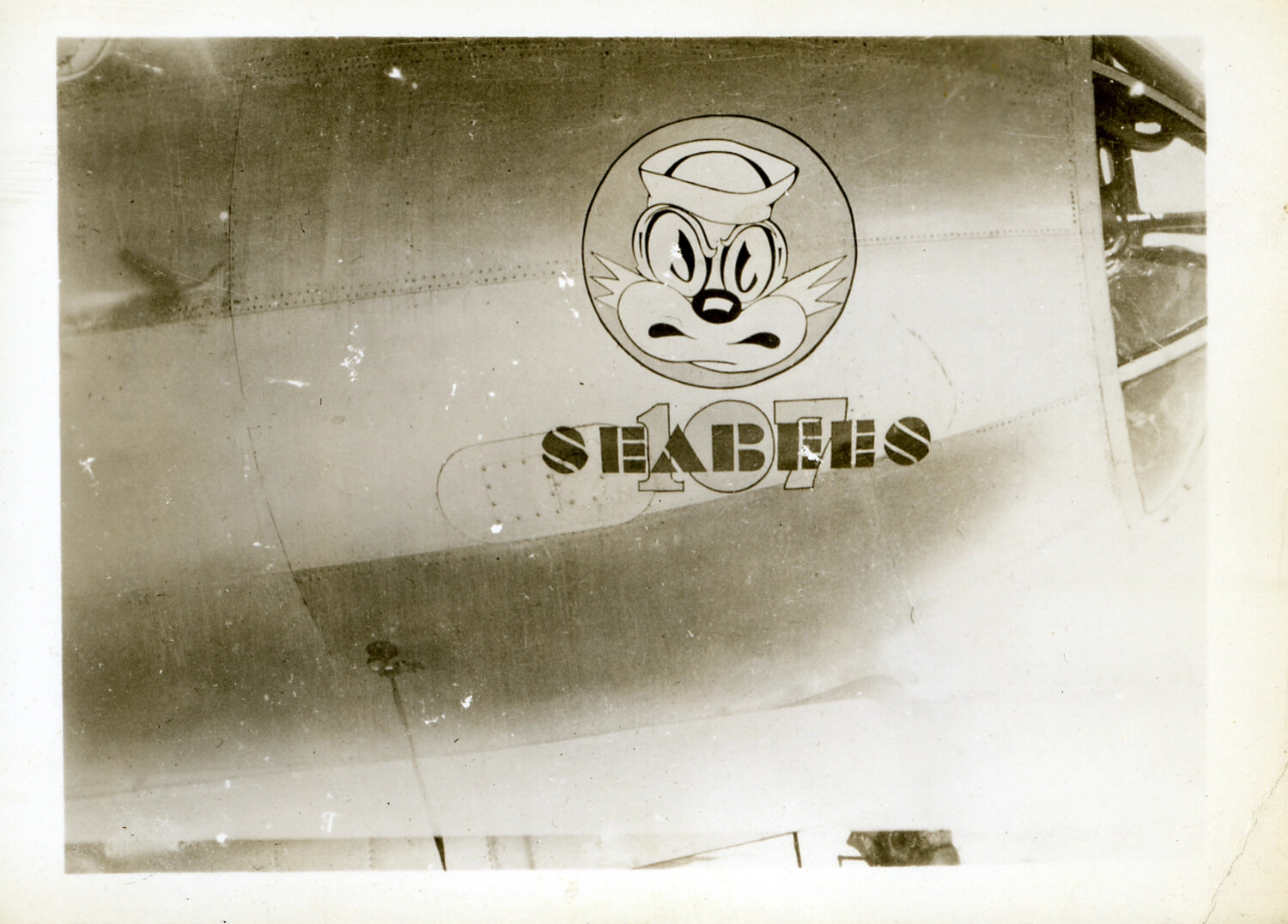 Nose Art Detail, Military Aircraft "107 Seabees" Insignia, Pacific Theater, World War II