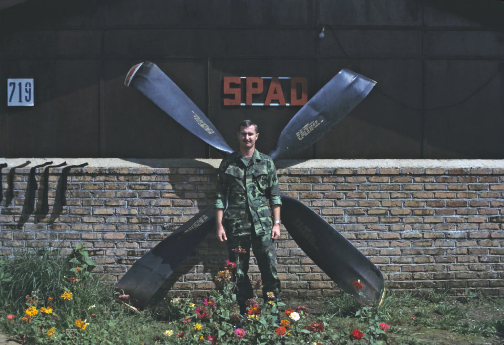 Airman Posing Before "SPAD" Propeller Display at Squadron Building 719