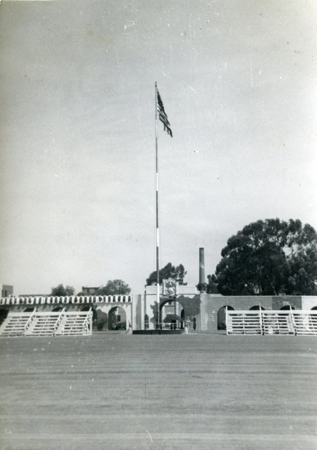 Parade Ground with Flagpole and Mission-Style Archway, Marine Corps Installation, 1945 (VMF-214 Album)