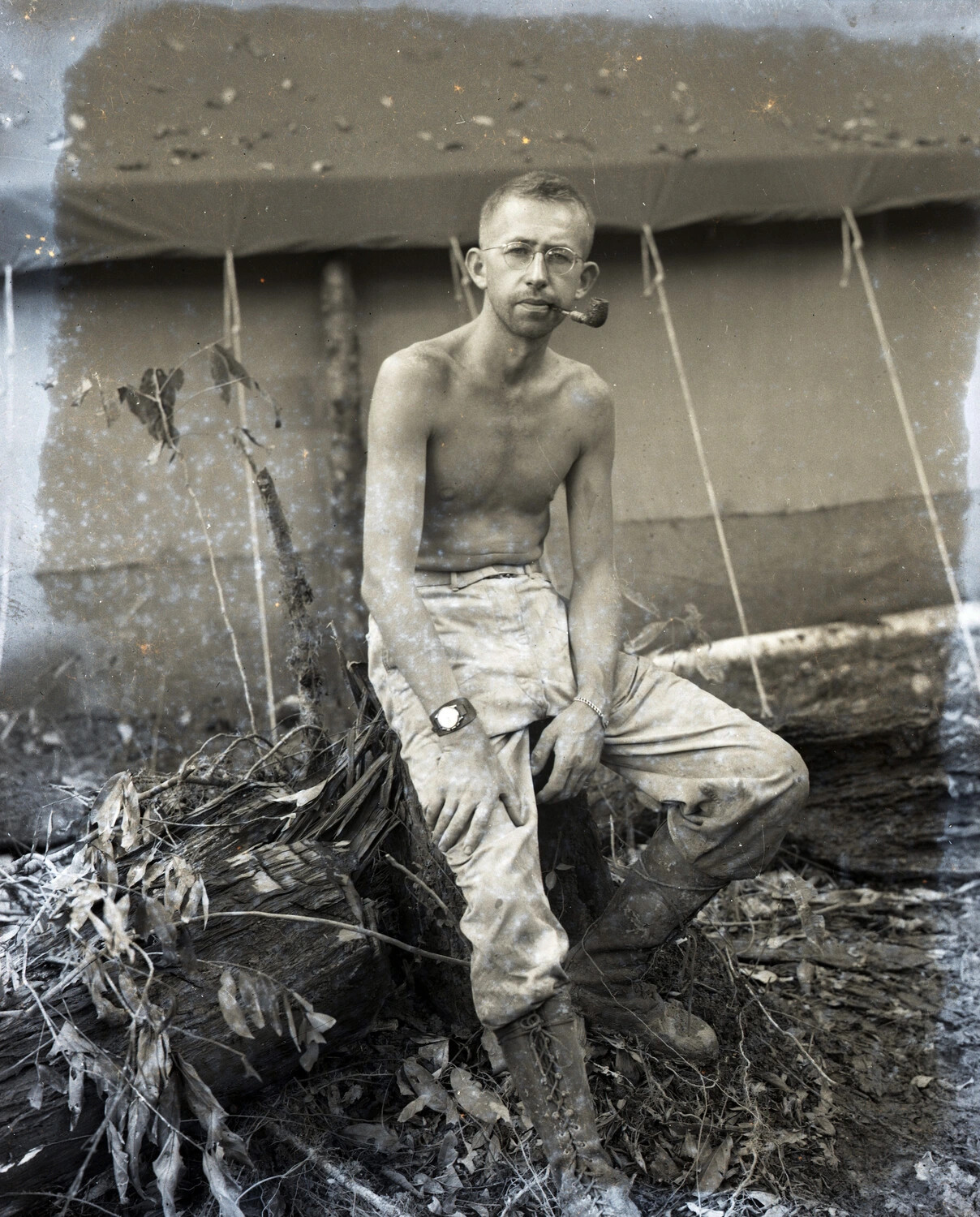 Shirtless Serviceman with Pipe and Wristwatch at Jungle Camp, China-Burma-India Theater, World War II