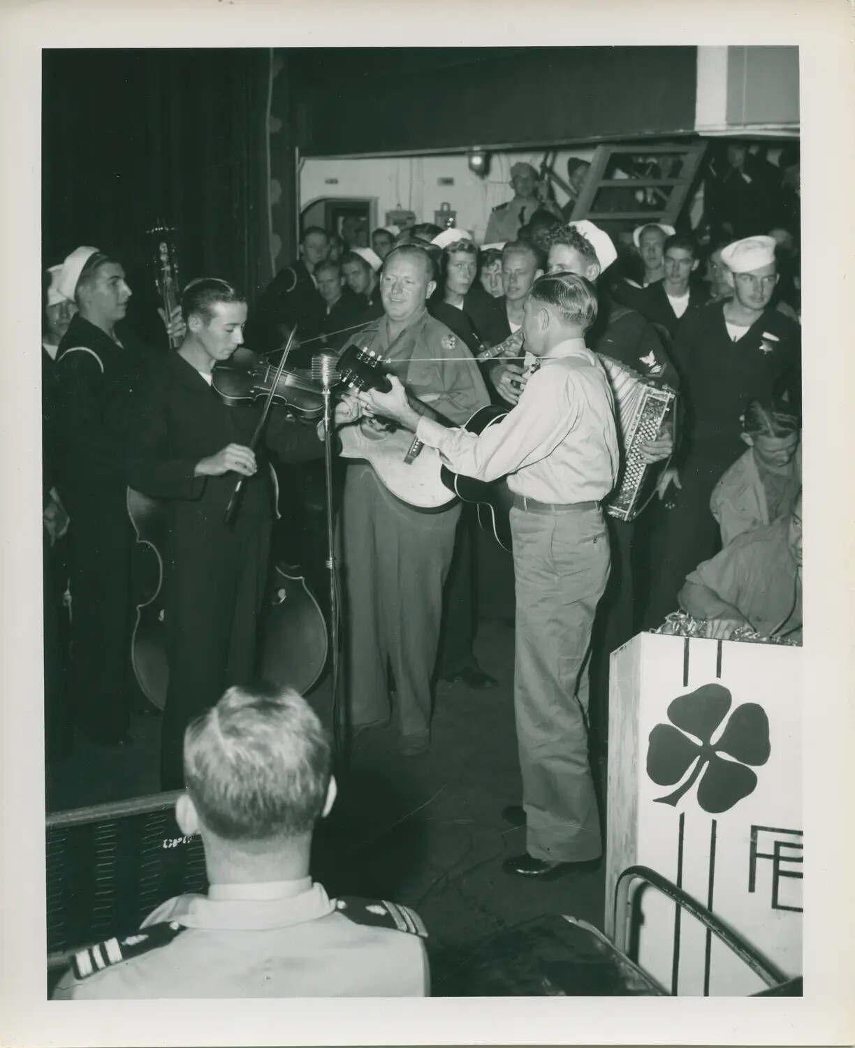 Sailors Gather for a Shipboard Musical Performance Aboard USS Petrof Bay (CVE-80)