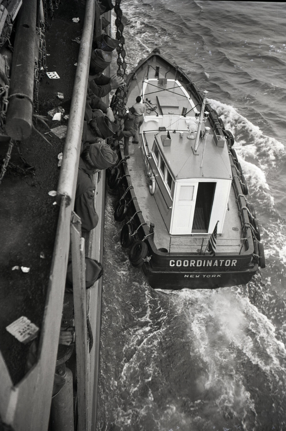 Harbor Tugboat 'Coordinator' Alongside Troop Transport, Port of New York, World War II Era