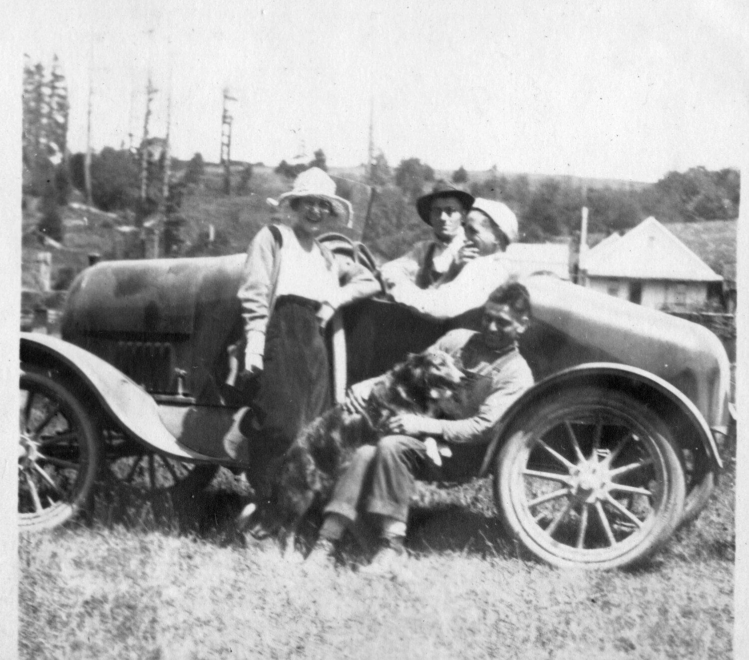 Group with Automobile and Dog in a Cutover Landscape, circa 1915-1922
