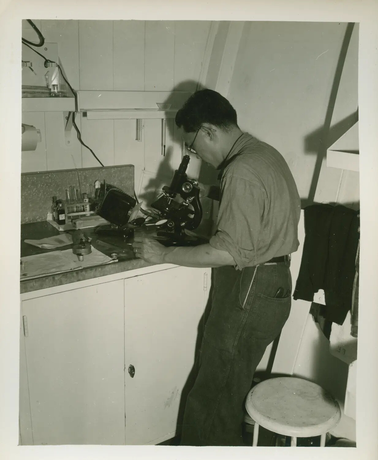 Shipboard Laboratory Technician at Microscope Aboard USS Petrof Bay (CVE-80)