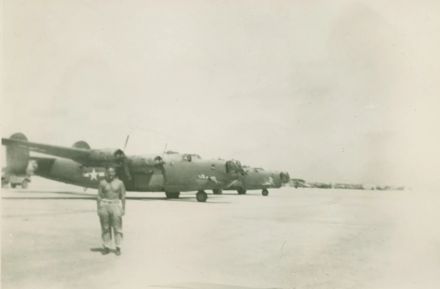 B-24 Liberator Bomber on Airfield Ramp with Serviceman, McAleer Collection, WWII