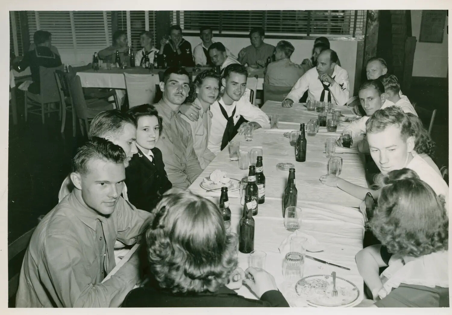 Navy Personnel and Guests at a Social Banquet, USS Petrof Bay (CVE-80) Collection, WWII Era