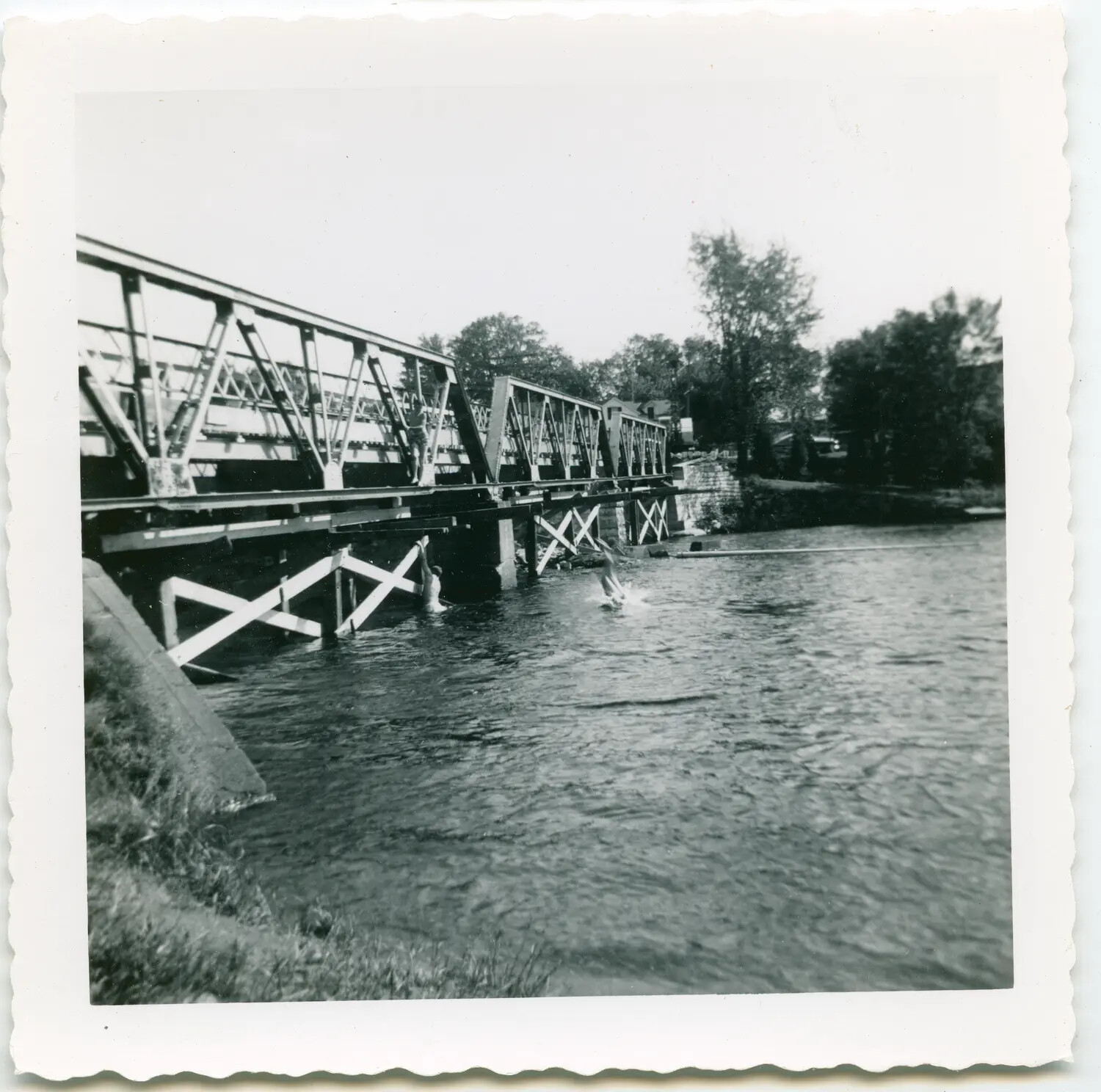 Boys Diving from a Steel Truss Bridge into a River, Mid-20th Century Snapshot