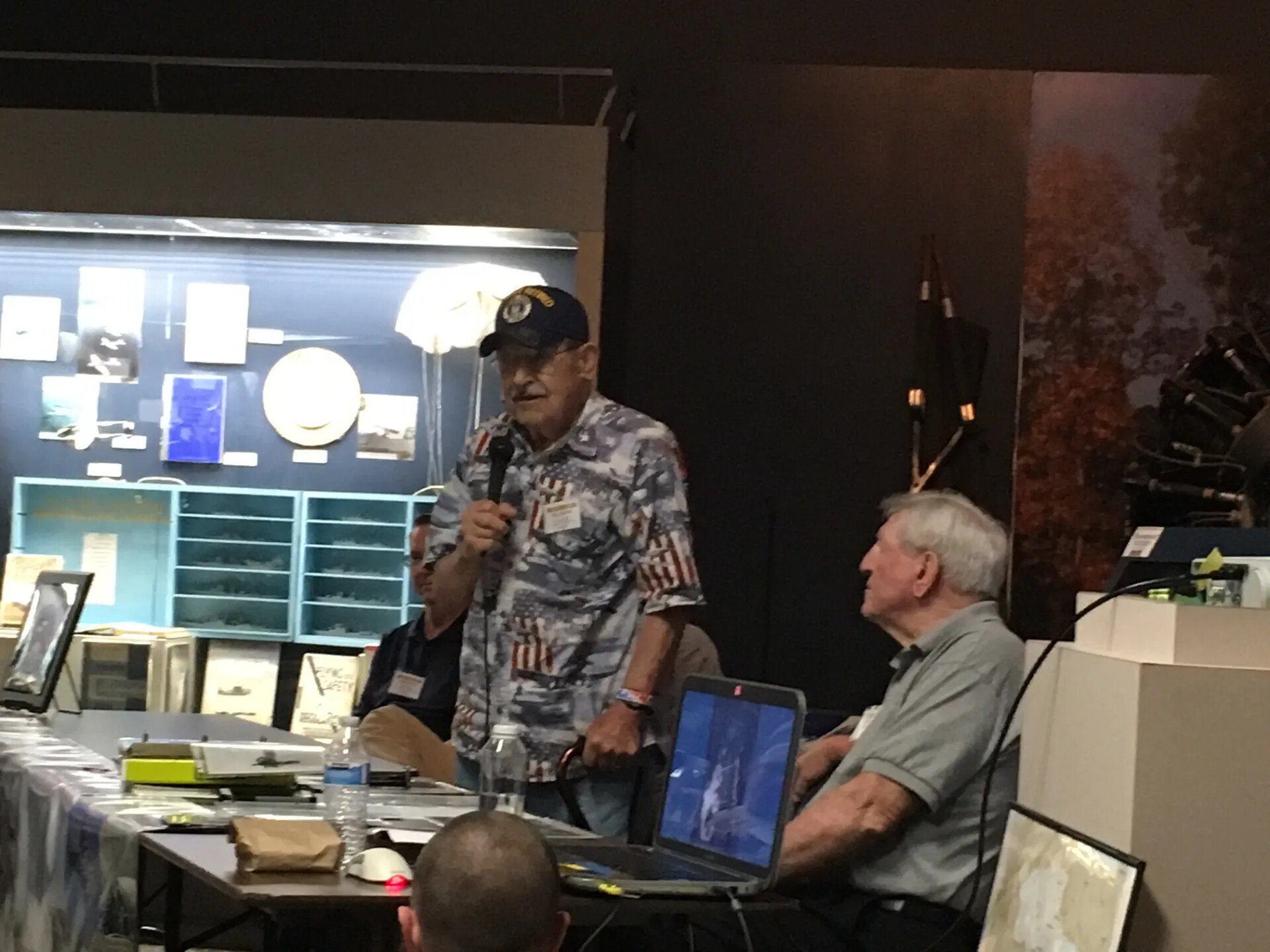 Veteran Speaking at Reunion Event, Aviation Museum Exhibit Hall