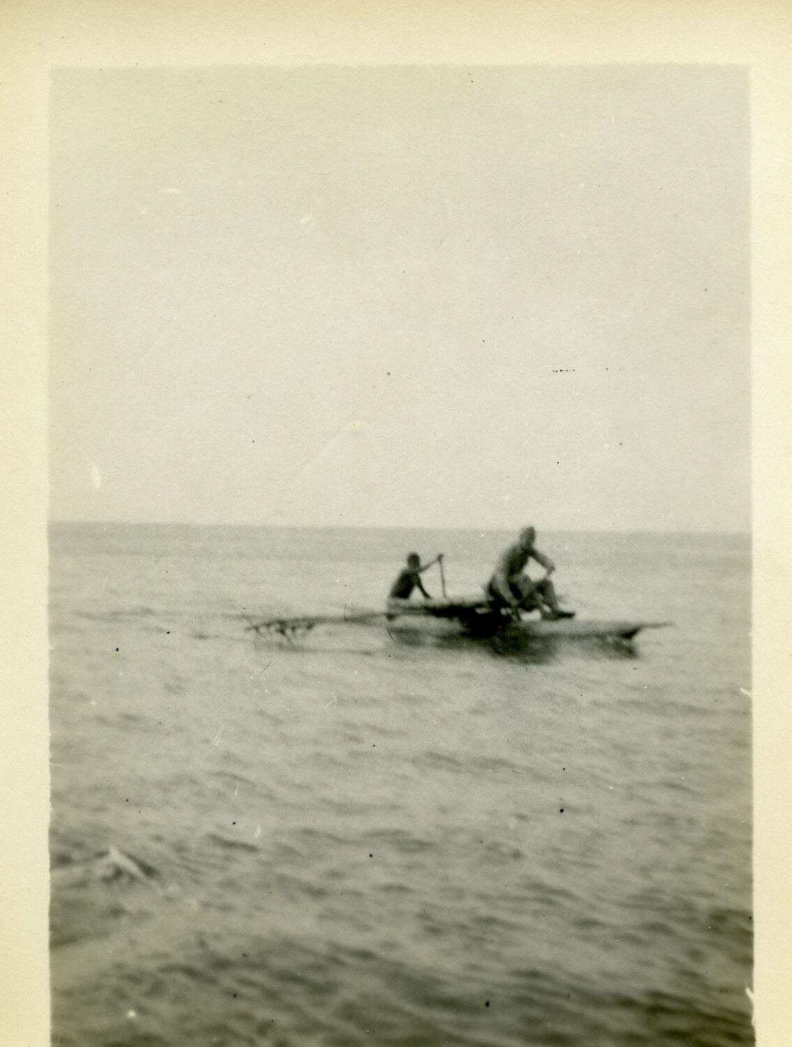 Islanders Paddling a Traditional Outrigger Canoe, South Pacific, WWII