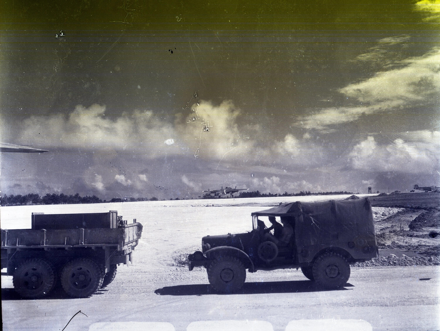 U.S. Army Trucks Crossing Airfield Road, 345th Bombardment Group Base, WWII Pacific Theater