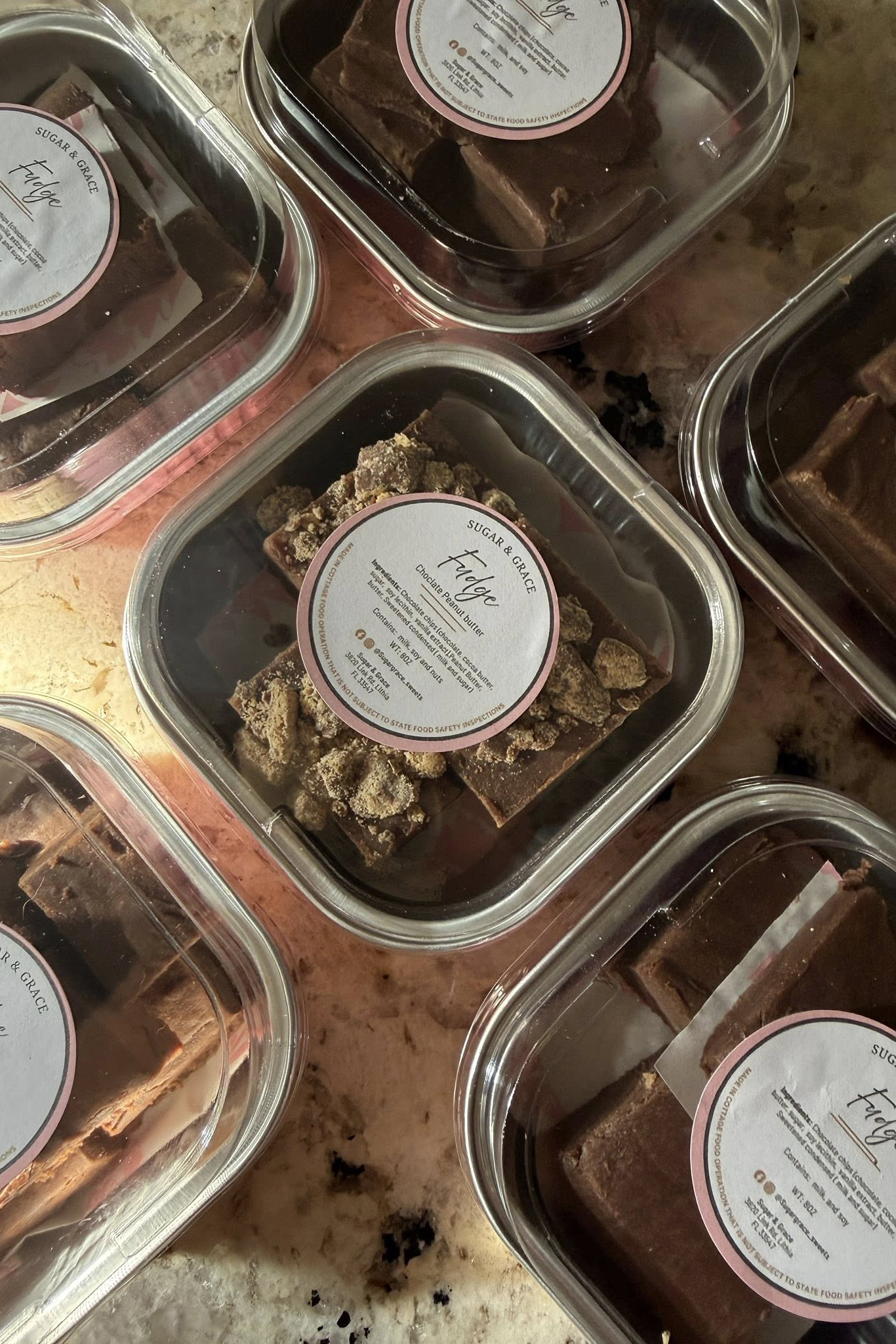 A Sugar and Grace baked-goods spread — sourdough loaves, gourmet cookies, mini Bundt cakes.