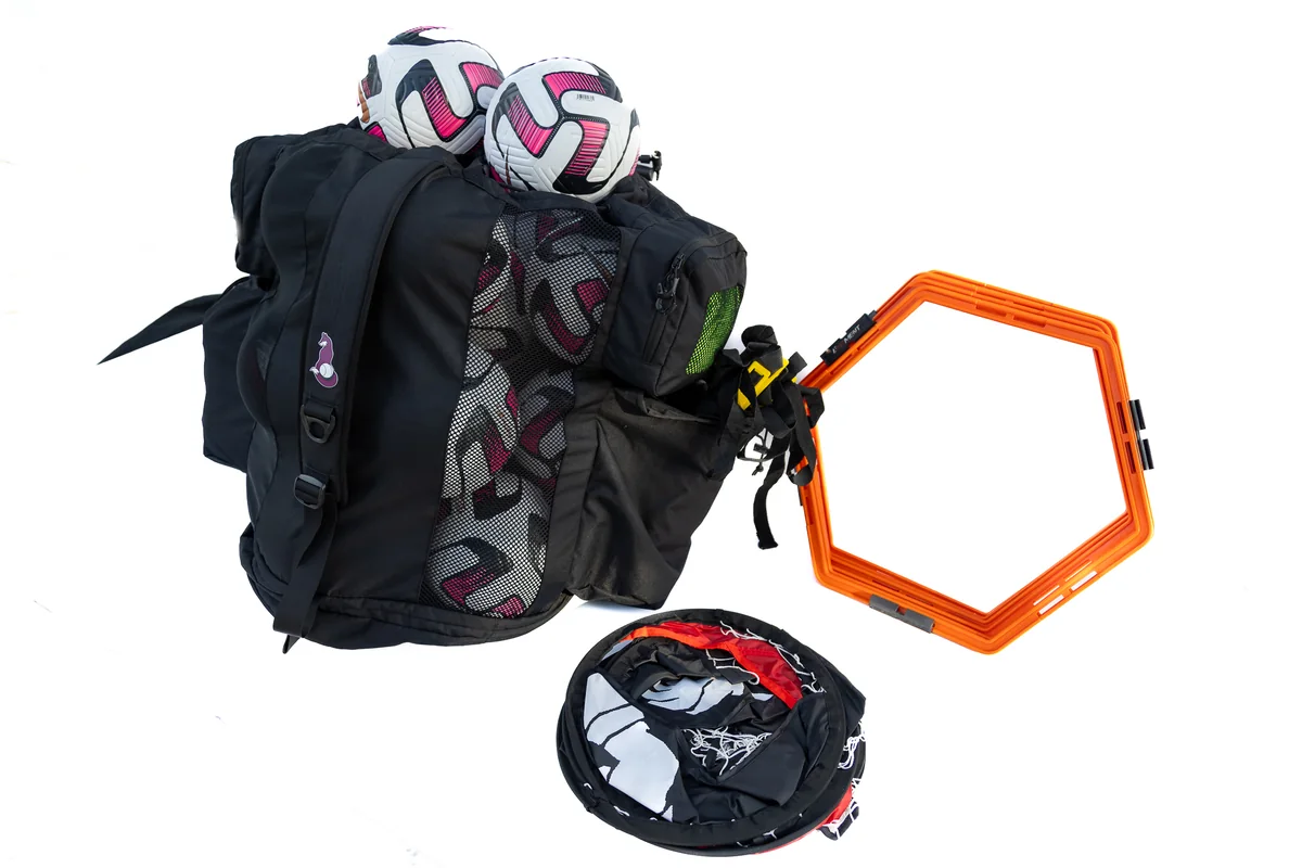 Loaded Ultimateballa coaching bag with training equipment on a white background