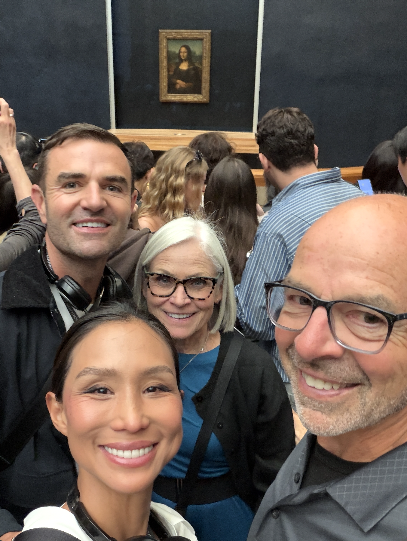 Paris with Mom and Dad in front of the Mona Lisa