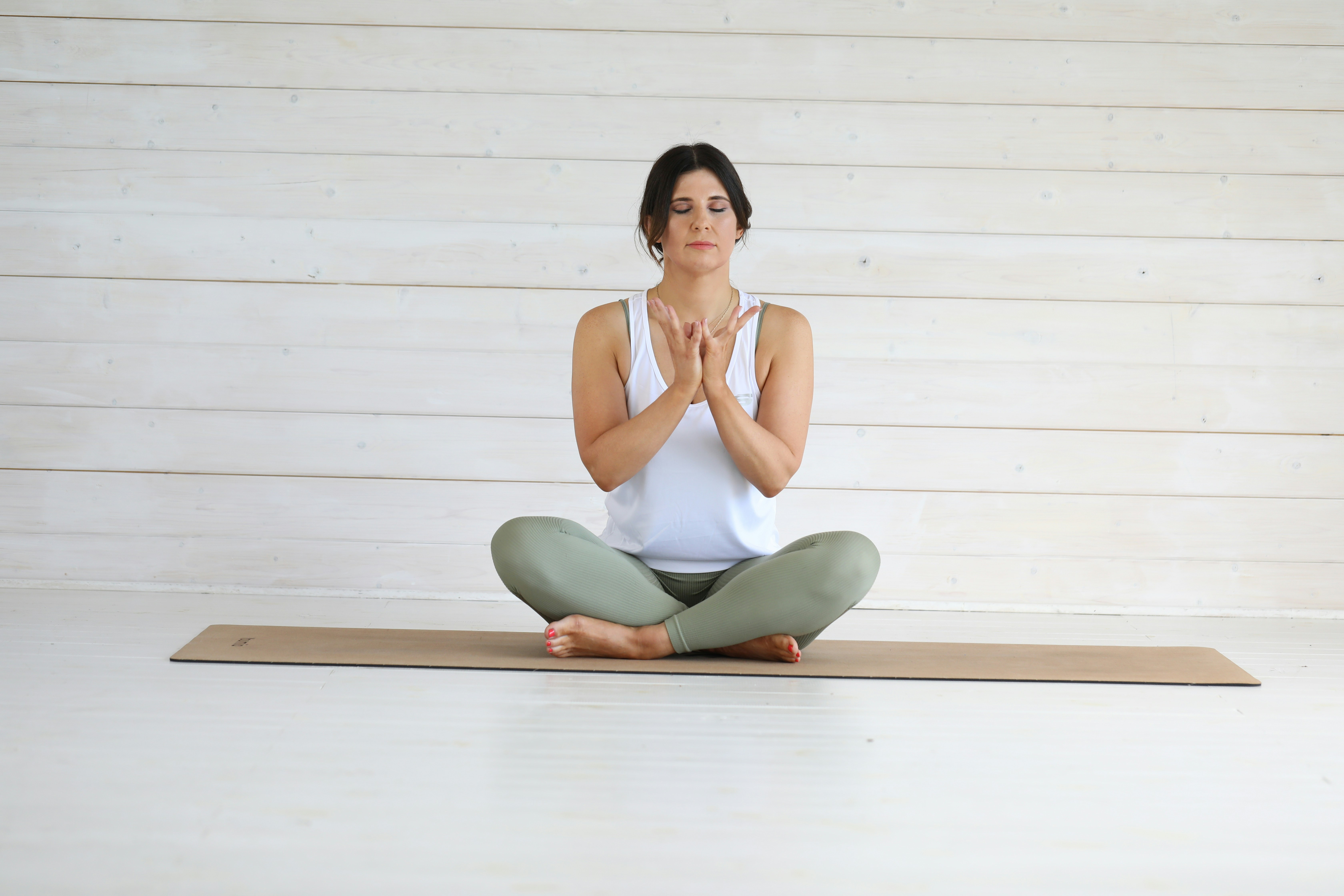 Woman practicing somatic therapy breathing techniques for stress and hormone balance