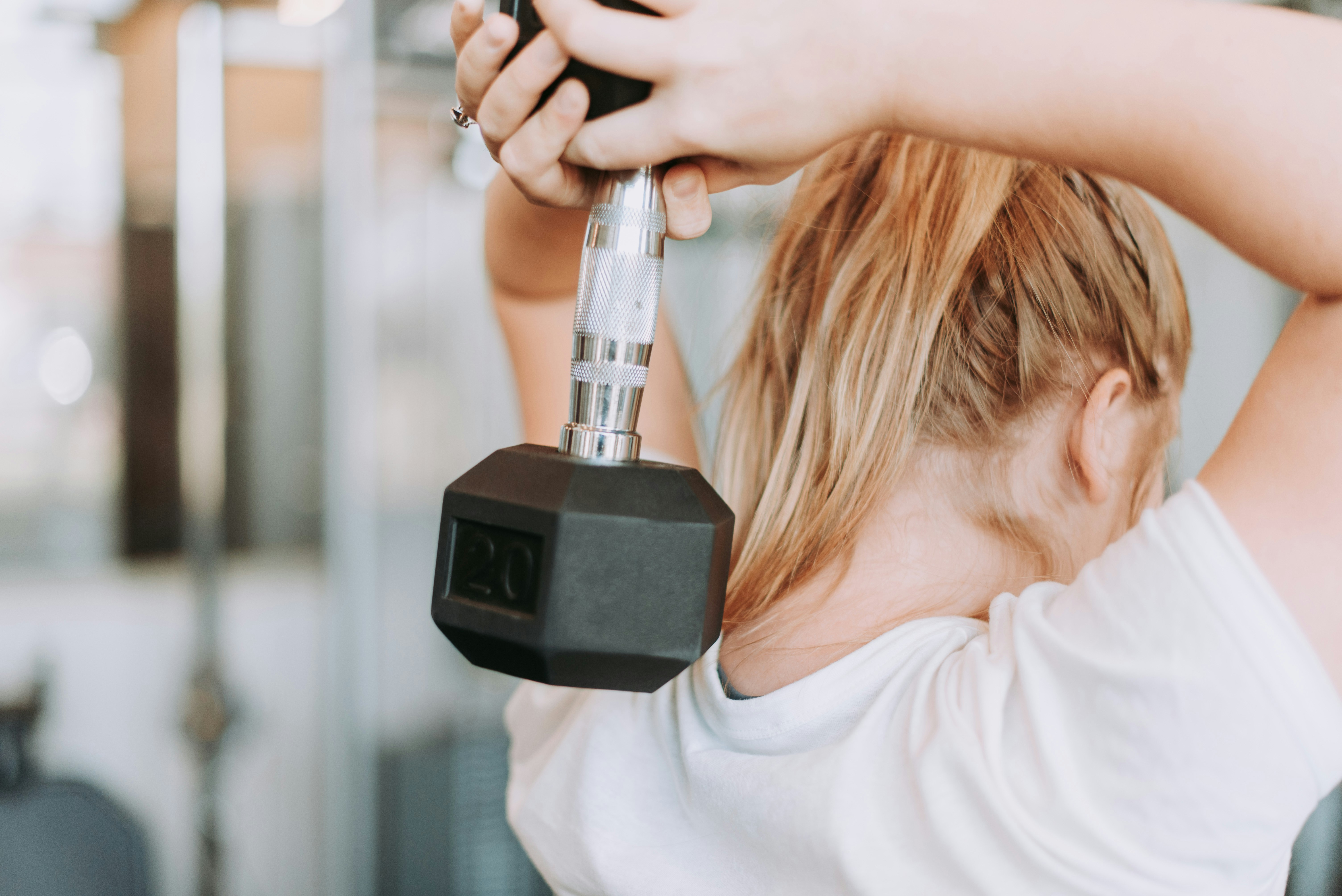 Woman doing resistance training to build muscle and protect bone health