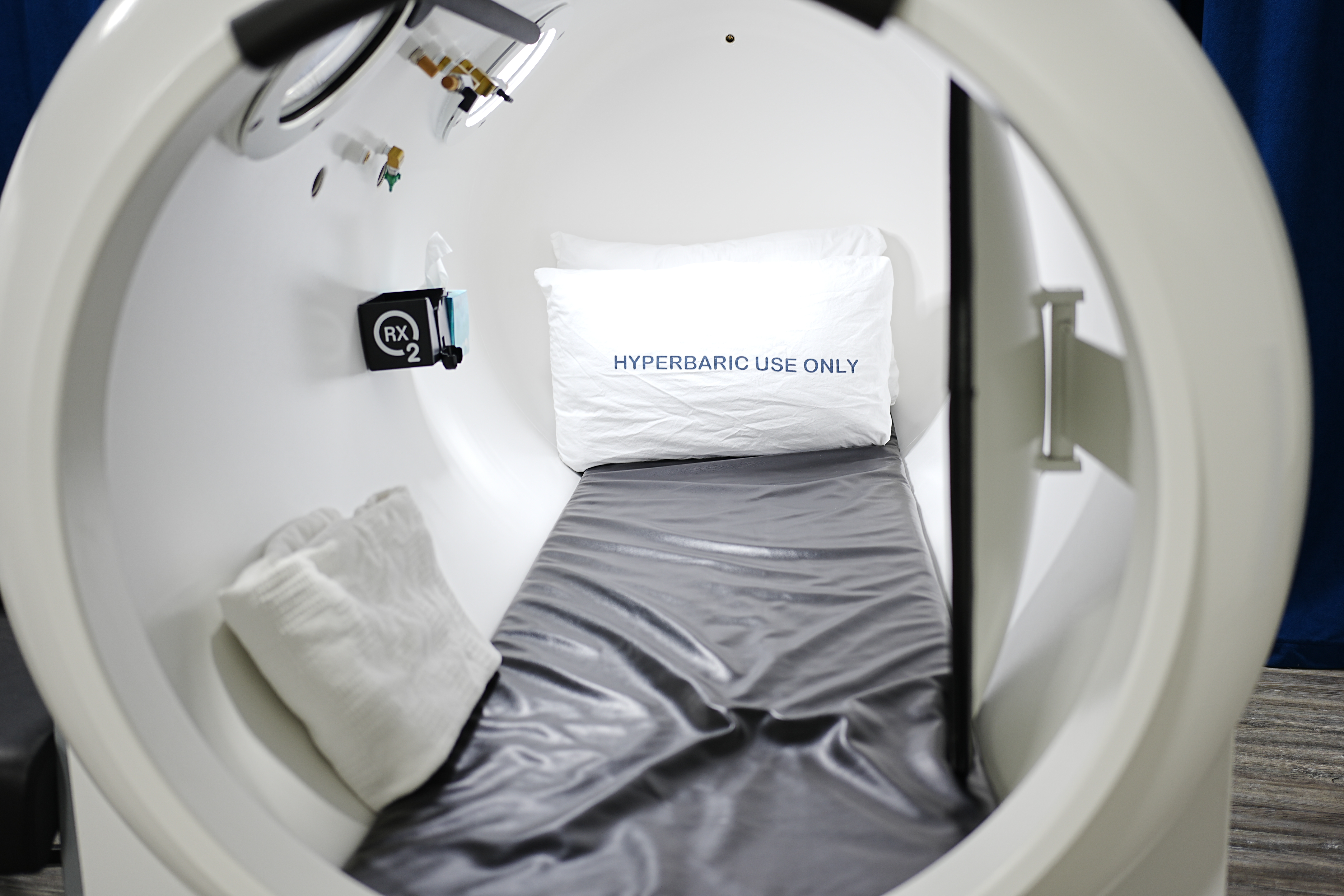 The open doorway and padded interior of an RX-O2 hyperbaric chamber
