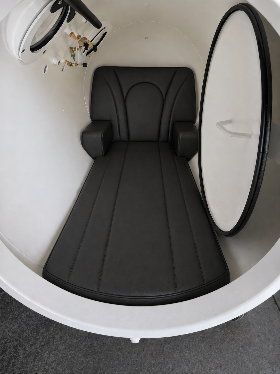 Padded seating inside an open hyperbaric chamber