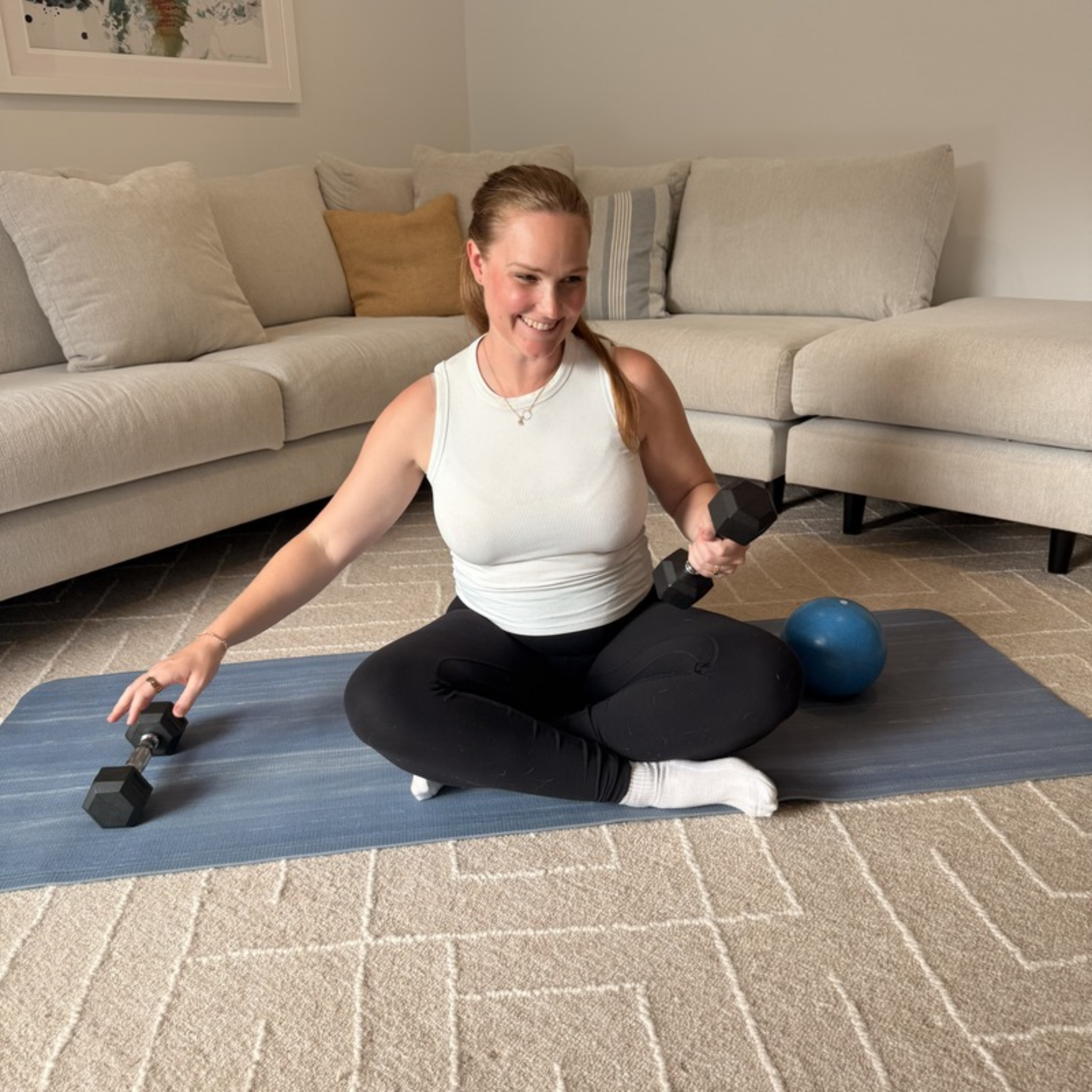 Mum doing a postpartum exercise at home