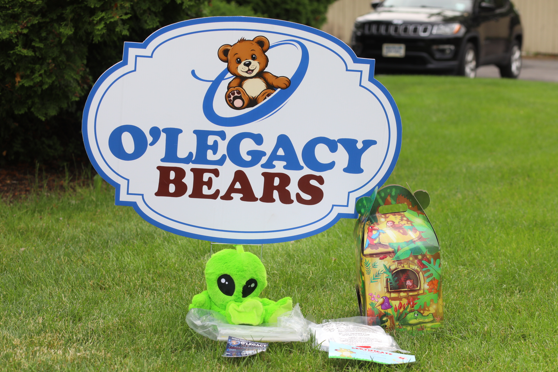 Alien plush kit displayed beneath the O’Legacy Bears sign