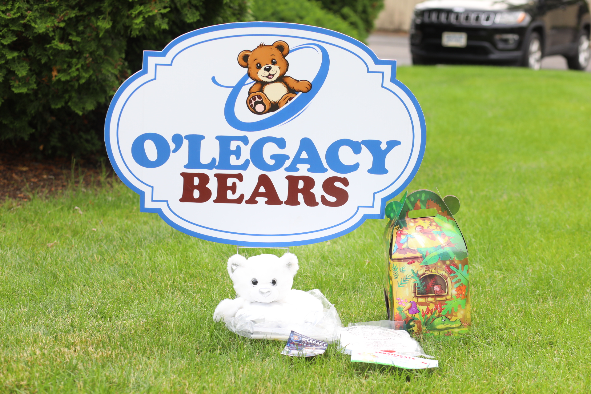 White bear stuffing kit displayed beneath the O’Legacy Bears sign