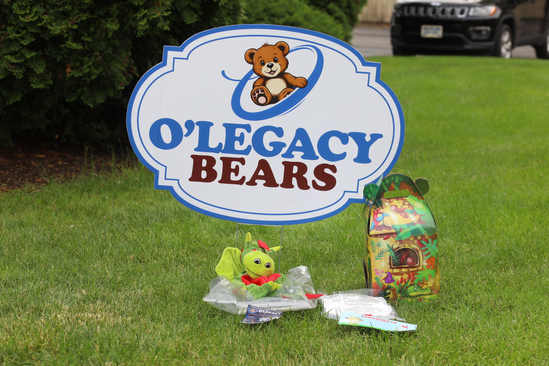 Dragon plush kit beneath the O’Legacy Bears sign