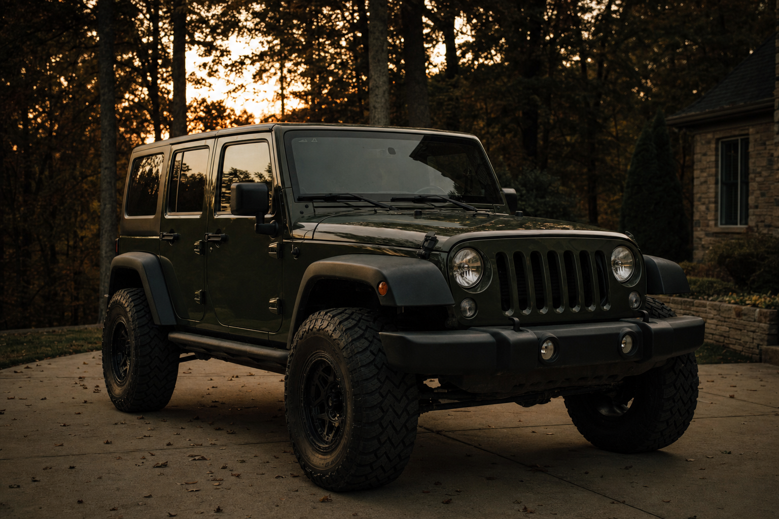 Jeep Wrangler front end in a driveway, death wobble repair