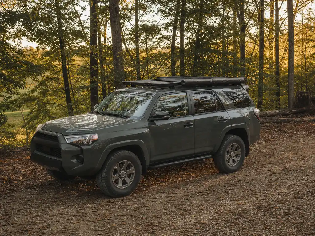 Toyota 4Runner with a roof rack, awning and rock sliders
