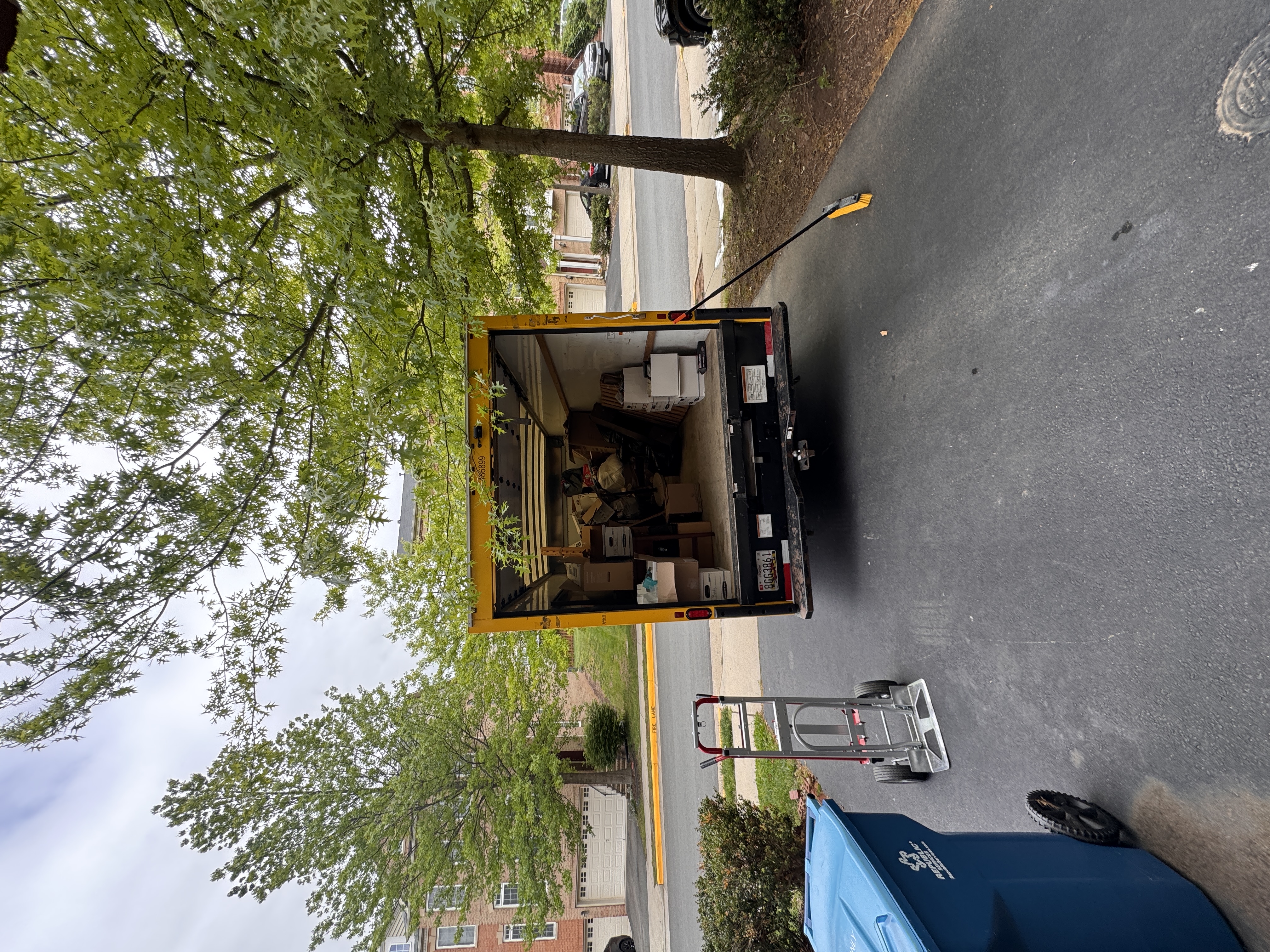 Stick & Moves crew loading junk from a DMV home into a truck Stick & Moves crew loading junk from a DMV home into a truck