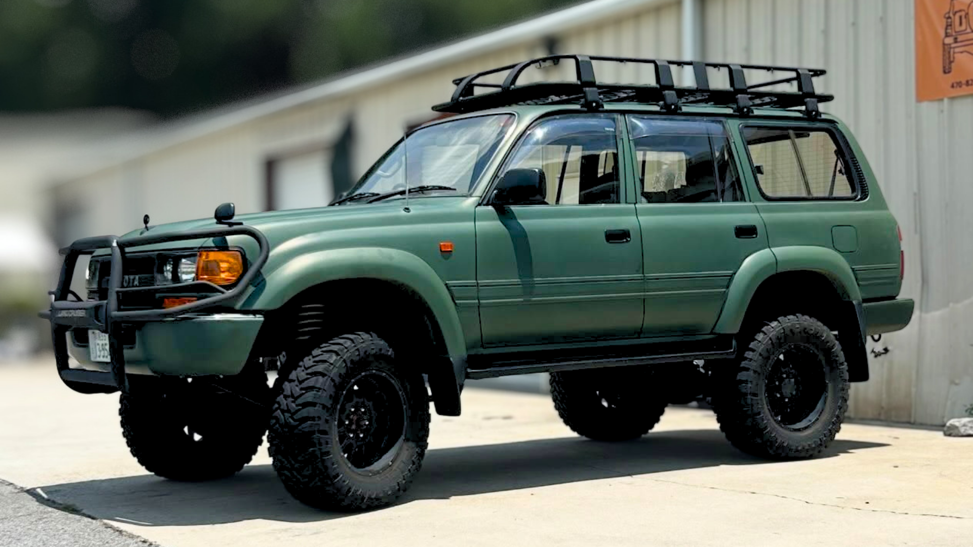 Toyota Land Cruiser off-road build with roof rack, front bumper and all-terrain tires