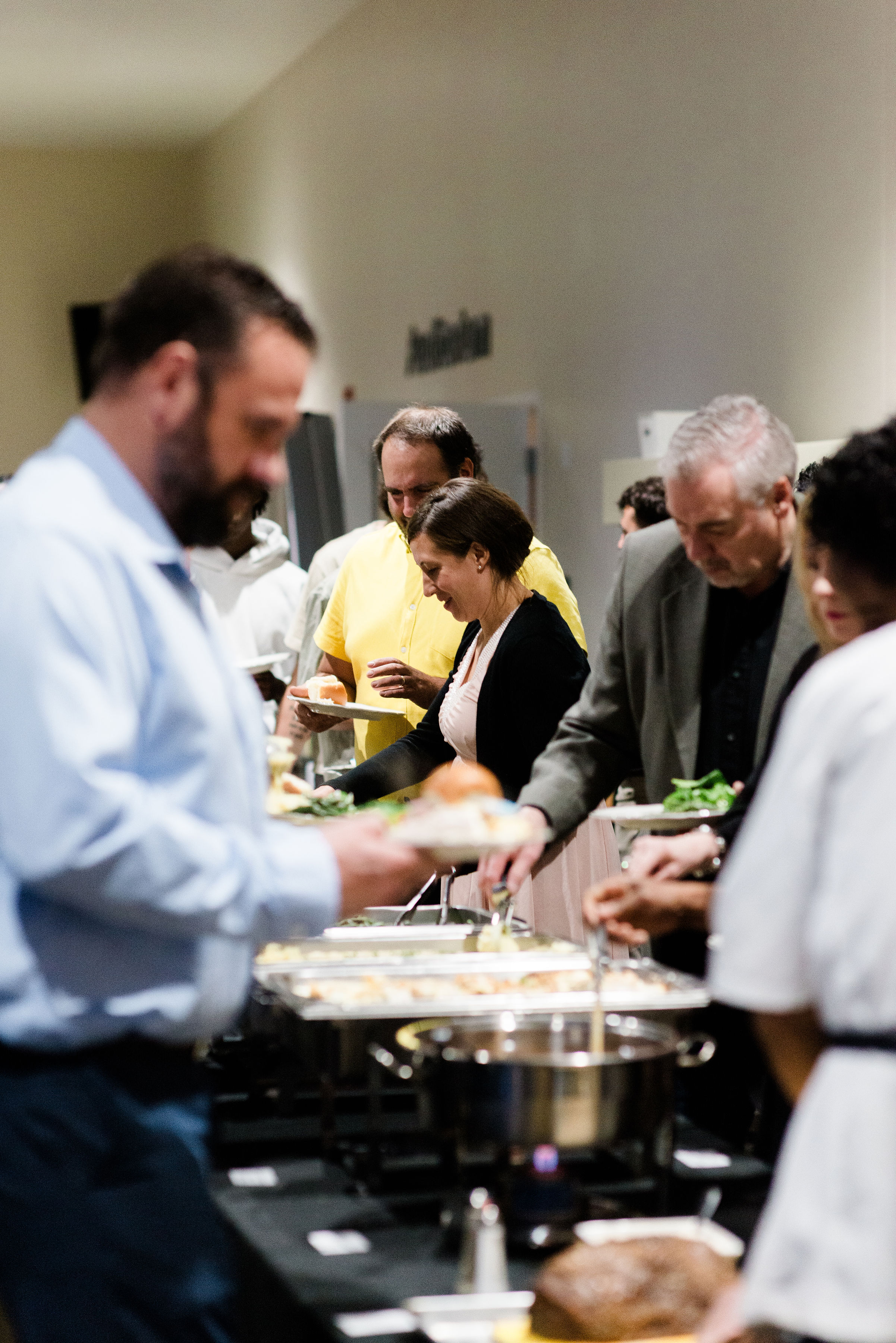 Guests sharing a meal around a banquet table